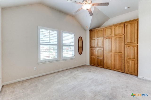 425 County Road 3830, San Antonio, TX 78253 - unfurnished bedroom with lofted ceiling, light colored carpet, baseboards, and a ceiling fan
