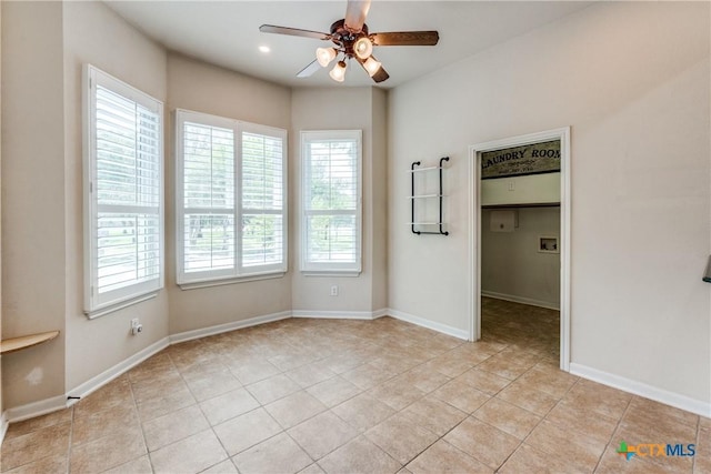 425 County Road 3830, San Antonio, TX 78253 - unfurnished bedroom with light tile patterned flooring, a spacious closet, ceiling fan, baseboards, and recessed lighting