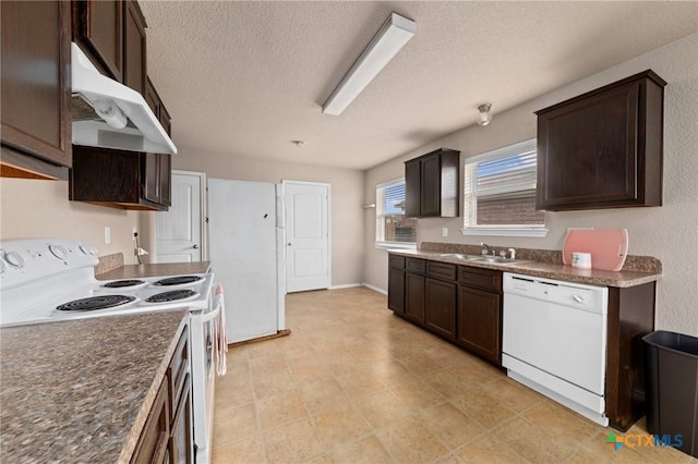 kitchen featuring dark brown cabinets, sink, a textured ceiling, and white appliances