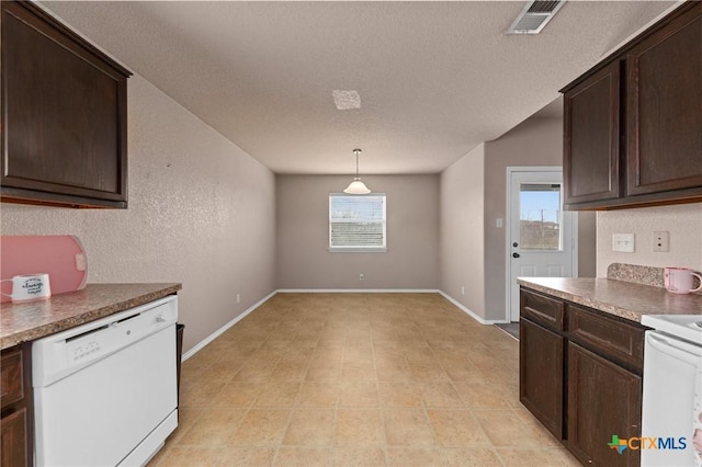 kitchen featuring dark brown cabinetry, decorative light fixtures, dishwasher, and a textured ceiling