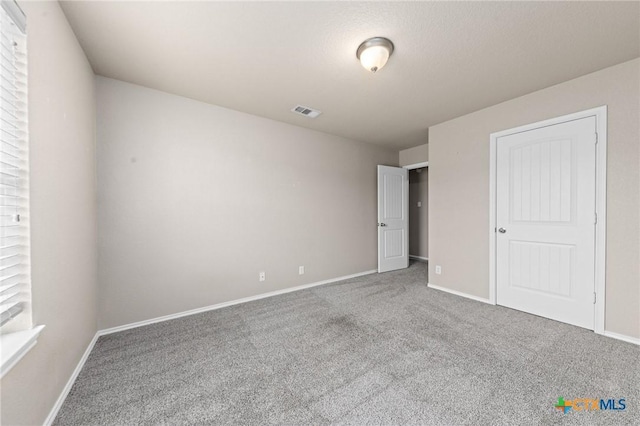 unfurnished bedroom with carpet floors