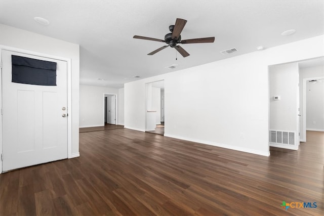 unfurnished living room with ceiling fan and dark hardwood / wood-style floors