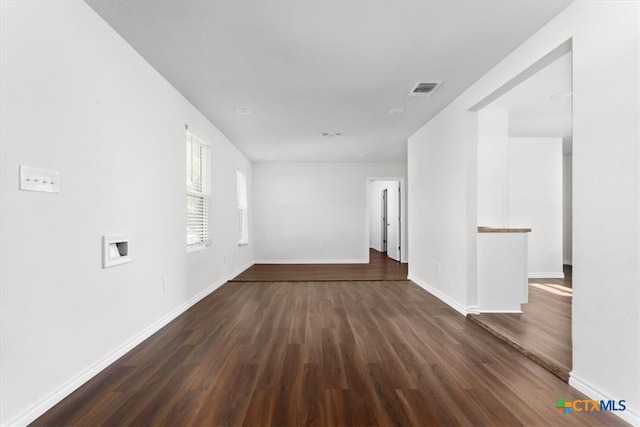 spare room featuring dark hardwood / wood-style flooring