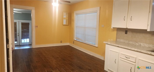 267 Illinois St, Bloomington, TX 77951 - unfurnished dining area featuring baseboards, dark wood finished floors, and ceiling fan