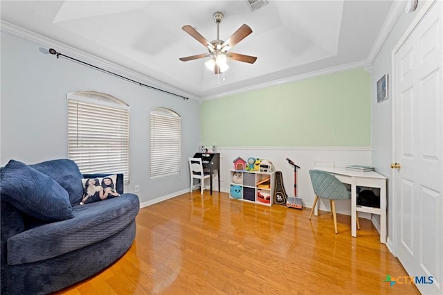 509 Sapphire Blvd, Hewitt, TX 76643 - sitting room with a raised ceiling, wood finished floors, ceiling fan, and crown molding