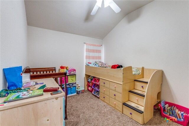 carpeted bedroom featuring lofted ceiling and ceiling fan