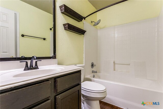 2154 Hidden Mdw, New Braunfels, TX 78130 - bathroom with toilet, wood finished floors, vanity, and shower / bathtub combination