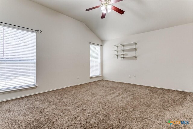 2154 Hidden Mdw, New Braunfels, TX 78130 - carpeted empty room featuring a healthy amount of sunlight, ceiling fan, baseboards, and lofted ceiling