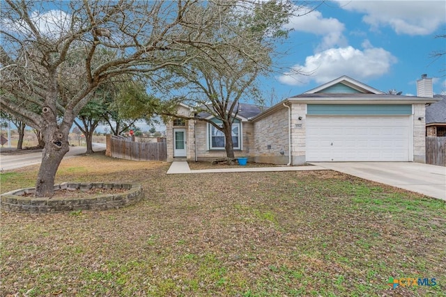 view of front of house featuring a garage and a front lawn