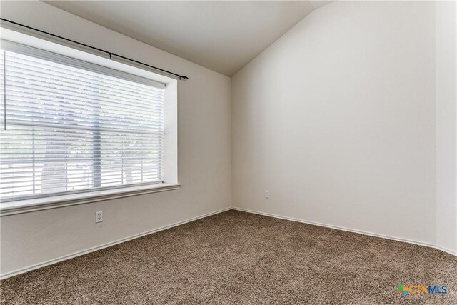 2154 Hidden Mdw, New Braunfels, TX 78130 - empty room featuring carpet floors, baseboards, and vaulted ceiling