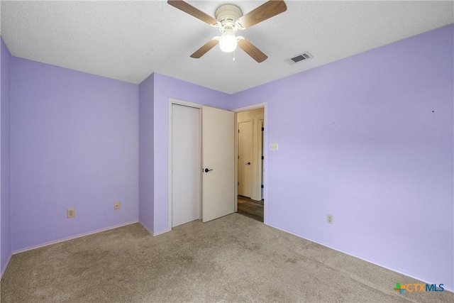 1007 Judy Ln, Copperas Cove, TX 76522 - unfurnished bedroom with carpet, a closet, and a ceiling fan