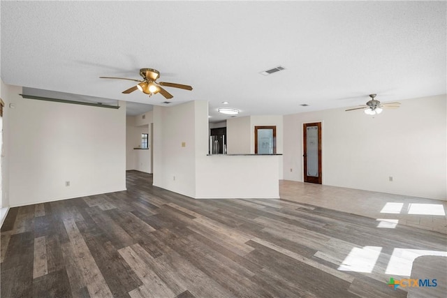 1007 Judy Ln, Copperas Cove, TX 76522 - unfurnished living room with ceiling fan and wood finished floors
