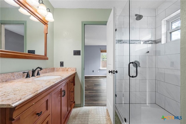 1007 Judy Ln, Copperas Cove, TX 76522 - bathroom with plenty of natural light, vanity, a stall shower, and tile patterned flooring