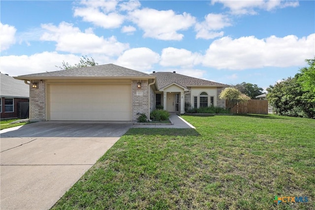1007 Judy Ln, Copperas Cove, TX 76522 - ranch-style house with driveway, an attached garage, and brick siding