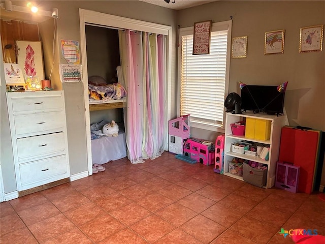 game room with tile patterned floors