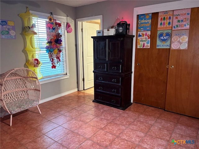 sitting room with tile patterned floors