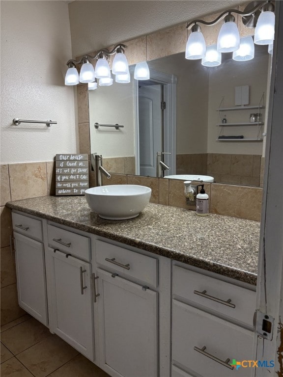 bathroom with vanity, tile patterned floors, and tile walls