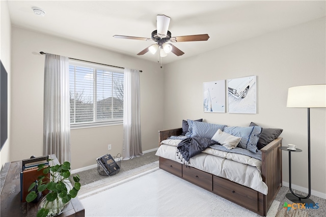 carpeted bedroom with ceiling fan