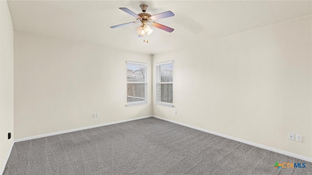 carpeted spare room with ceiling fan