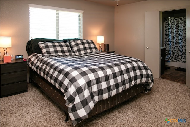 bedroom featuring light colored carpet