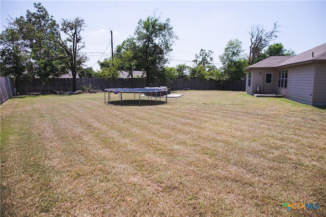 view of yard with a trampoline