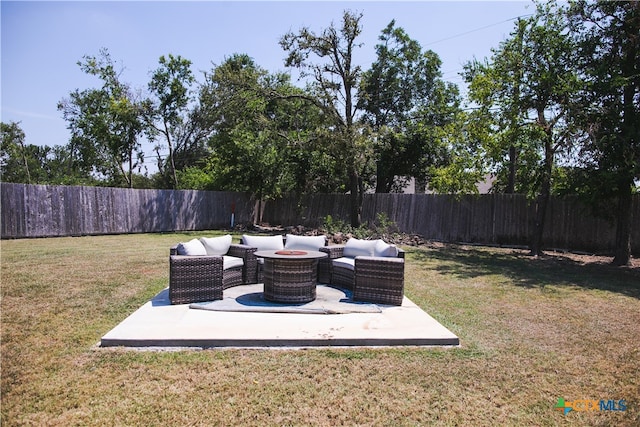 view of yard with an outdoor living space and a patio area