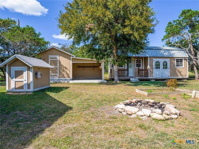 single story home with a shed and a front lawn