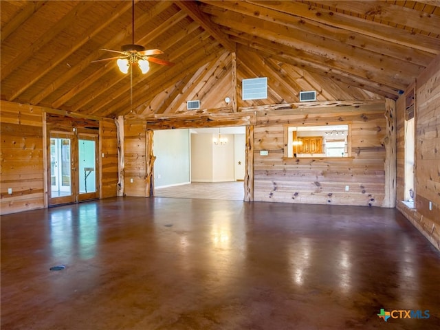 unfurnished living room featuring concrete flooring, beam ceiling, high vaulted ceiling, wood walls, and ceiling fan