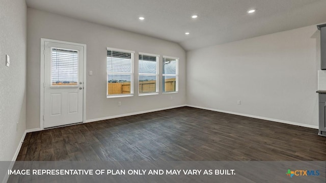 unfurnished living room with dark hardwood / wood-style floors and vaulted ceiling