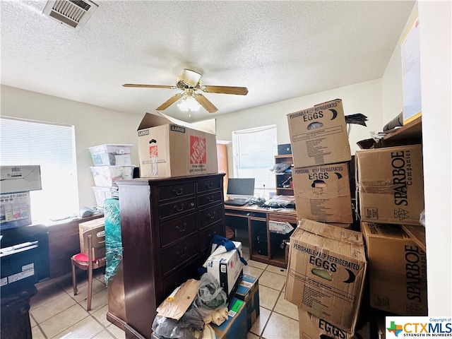 interior space featuring ceiling fan