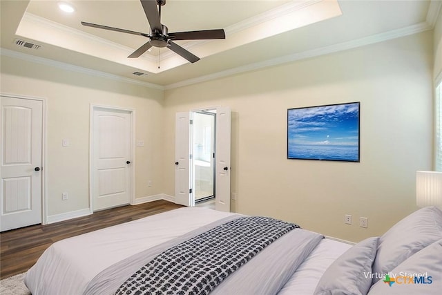 1010 Winchester Dr, Nolanville, TX 76559 - bedroom with a raised ceiling, wood finished floors, ornamental molding, and a ceiling fan