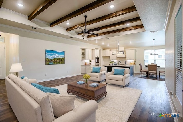 1010 Winchester Dr, Nolanville, TX 76559 - living room featuring dark wood finished floors, ceiling fan, beam ceiling, and recessed lighting