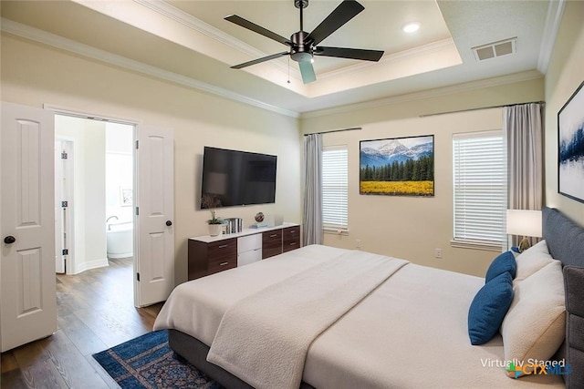 1010 Winchester Dr, Nolanville, TX 76559 - bedroom featuring dark wood finished floors, crown molding, multiple windows, a tray ceiling, and recessed lighting