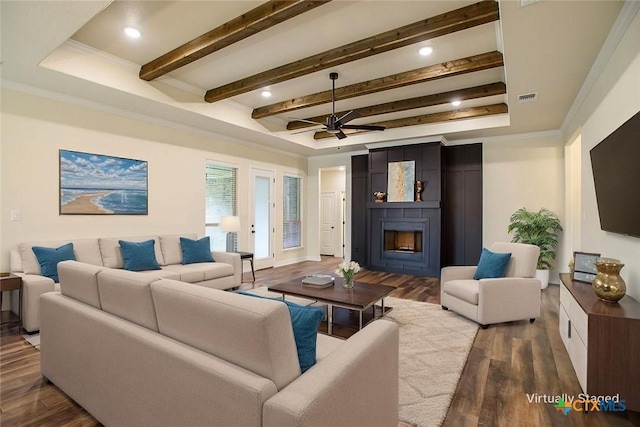 1010 Winchester Dr, Nolanville, TX 76559 - living room featuring dark wood-style flooring, a fireplace, ceiling fan, ornamental molding, and beam ceiling