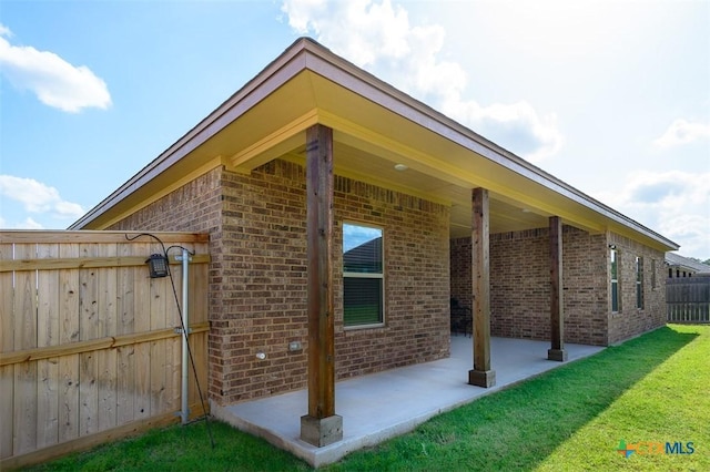 1010 Winchester Dr, Nolanville, TX 76559 - view of home's exterior featuring brick siding and a patio area