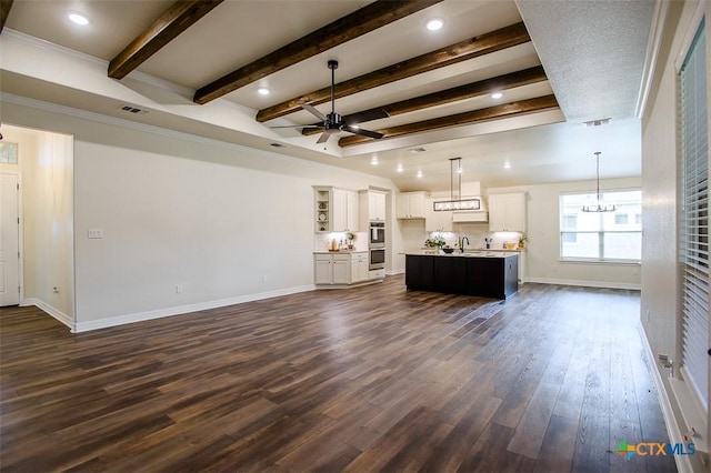 1010 Winchester Dr, Nolanville, TX 76559 - living room with a ceiling fan, beam ceiling, and dark wood finished floors