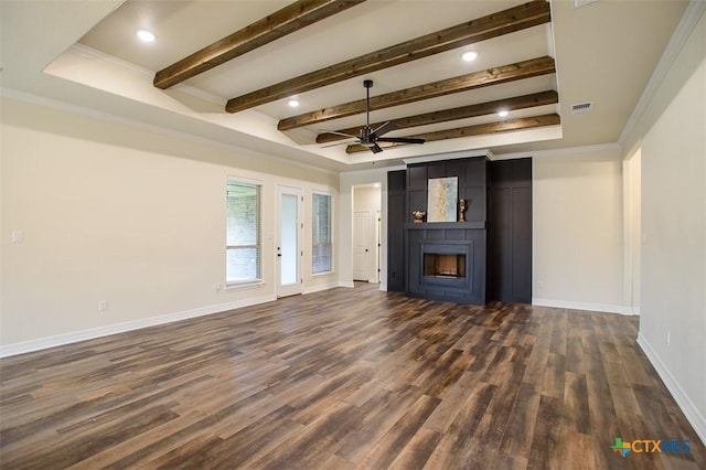 1010 Winchester Dr, Nolanville, TX 76559 - unfurnished living room featuring a ceiling fan, dark wood-style flooring, a fireplace, ornamental molding, and beam ceiling