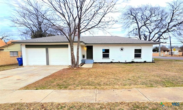 view of front facade with a front lawn and a garage