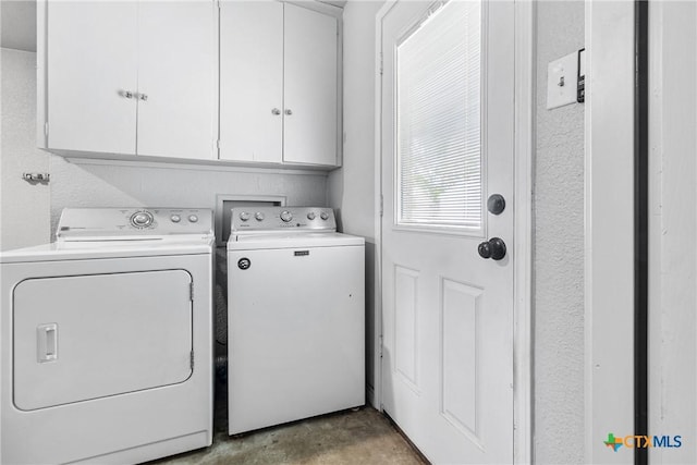 laundry room featuring cabinet space and washer and dryer