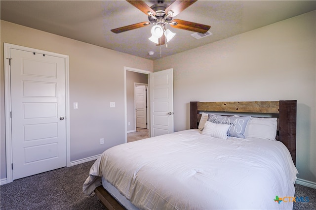 bedroom with dark carpet and ceiling fan