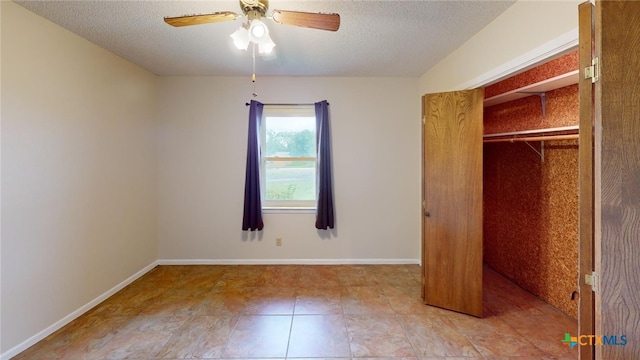 unfurnished bedroom with a textured ceiling, light tile patterned flooring, ceiling fan, and a closet