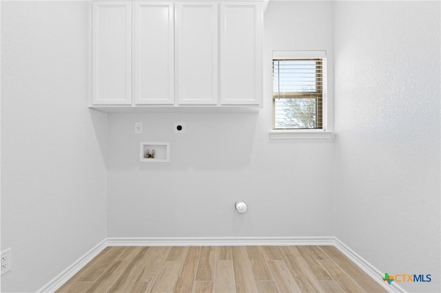 clothes washing area with hookup for a washing machine, hookup for an electric dryer, cabinets, and light hardwood / wood-style flooring