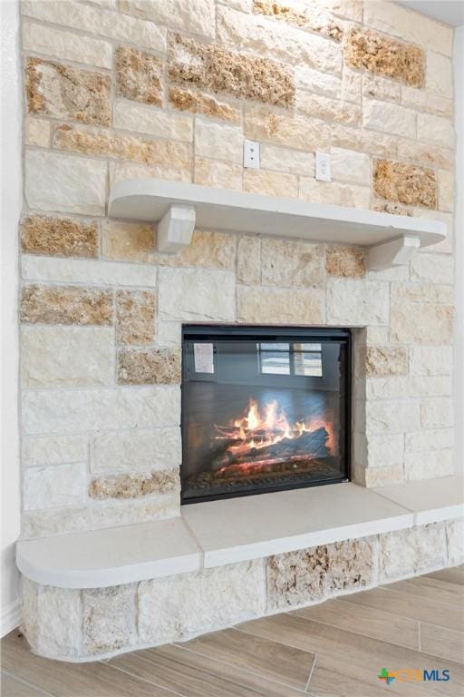 interior details with a stone fireplace