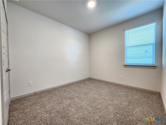 view of carpeted spare room