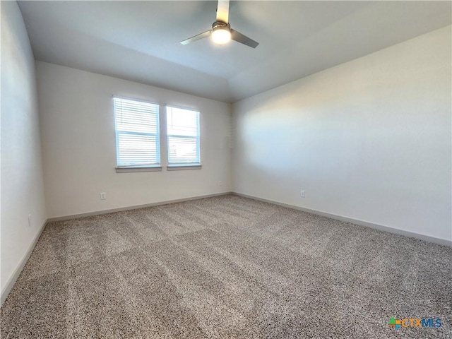 carpeted empty room with ceiling fan