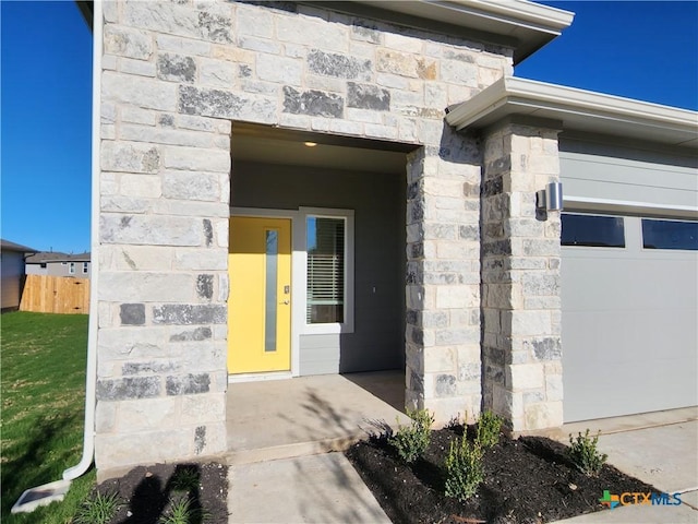 doorway to property featuring a garage