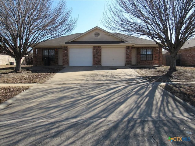 single story home featuring a garage