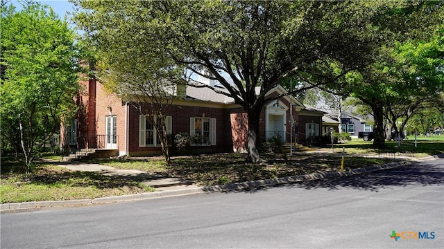 view of front of house with brick siding
