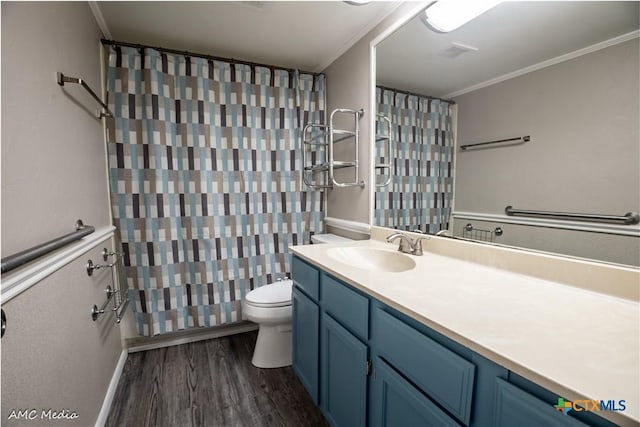 bathroom featuring vanity, hardwood / wood-style flooring, ornamental molding, and toilet