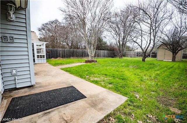 view of yard with a storage unit and a patio